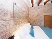 Posteľ alebo postele v izbe v ubytovaní Hotel Molí de l'Escala