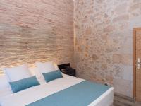 Posteľ alebo postele v izbe v ubytovaní Hotel Molí de l'Escala