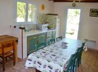 a kitchen with a table with a table cloth on it at Chambres d&#39;Hôtes de Curnier in Bédoin