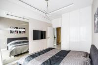 Łóżko lub łóżka w pokoju w obiekcie Exclusive Trendy Apartments