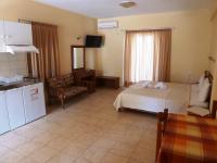 Łóżko lub łóżka w pokoju w obiekcie Elafonisos Diamond Resort