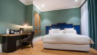 A bed or beds in a room at Soho Boutique Congreso