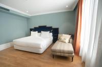 A bed or beds in a room at Soho Boutique Congreso