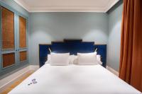 A bed or beds in a room at Soho Boutique Congreso