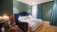 A bed or beds in a room at Soho Boutique Congreso