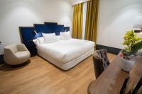 A bed or beds in a room at Soho Boutique Congreso