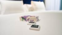 A bed or beds in a room at Soho Boutique Congreso