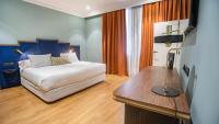 A bed or beds in a room at Soho Boutique Congreso