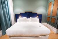 A bed or beds in a room at Soho Boutique Congreso