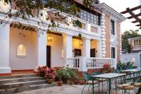 a patio with tables and chairs in front of a building at Thamel Villa Heritage Hotel in Kathmandu