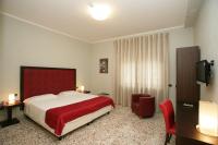 Posteľ alebo postele v izbe v ubytovaní Hotel Piazza Marconi