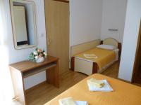 Postel nebo postele na pokoji v ubytování Apartments Pjer