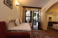 A bed or beds in a room at Villa Konak Hotel