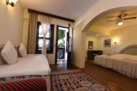 A bed or beds in a room at Villa Konak Hotel