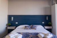 Posteľ alebo postele v izbe v ubytovaní Elisir Suite Rooms by Marino Tourist