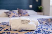 Posteľ alebo postele v izbe v ubytovaní Elisir Suite Rooms by Marino Tourist