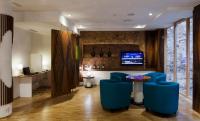 A television and/or entertainment centre at Ako Suite Hotel