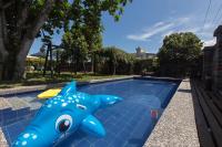 a pool with a blue shark toy next to it at Gengmengyuan B&amp;B in Xikou