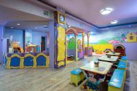 a childrens room with a playroom with a table and play equipment at Herods Palace Hotels & Spa Eilat a Premium collection by Fattal Hotels in Eilat