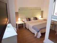 Postel nebo postele na pokoji v ubytování Hotel Horizonte