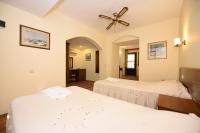 A bed or beds in a room at Villa Konak Hotel