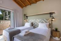 Posteľ alebo postele v izbe v ubytovaní Danai Villa by PaxosRetreats