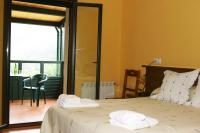 Postel nebo postele na pokoji v ubytování Hotel Restaurante Canero