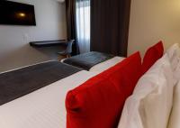 Uma cama ou camas num quarto em Sport Hotel Gym + SPA
