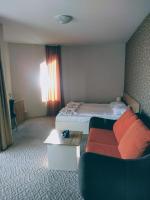 Postel nebo postele na pokoji v ubytování Hotel Mida