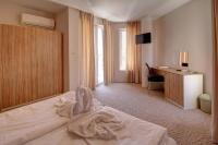 Postel nebo postele na pokoji v ubytování Hotel Mida