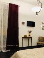 Televízia a/alebo spoločenská miestnosť v ubytovaní A Casa di Claudia