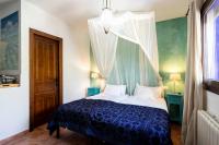 a bedroom with a bed with a canopy at Paraiso Perdido in Conil de la Frontera