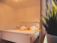 A bed or beds in a room at Postwirt Annaberg