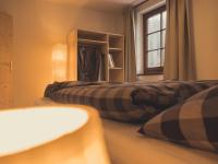 A bed or beds in a room at Postwirt Annaberg