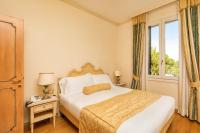 Posteľ alebo postele v izbe v ubytovaní Hotel Villa Laguna