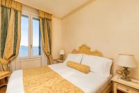Posteľ alebo postele v izbe v ubytovaní Hotel Villa Laguna