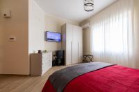 A bed or beds in a room at Napoli d'Amare B&B
