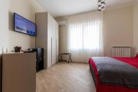 A bed or beds in a room at Napoli d'Amare B&B