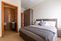 A bed or beds in a room at Napoli d'Amare B&B
