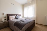 A bed or beds in a room at Napoli d'Amare B&B