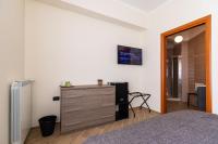 A television and/or entertainment centre at Napoli d'Amare B&B