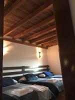 Łóżko lub łóżka w pokoju w obiekcie VTAR Don Benito, su casa rural en Gilena