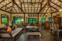a living room with a couch and a table at Koh Jum Beach Villas "A member of Secret Retreats" in Ko Jum