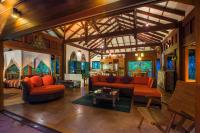a living room with two couches and a table at Koh Jum Beach Villas "A member of Secret Retreats" in Ko Jum