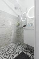 a bathroom with a shower with a glass door at Charming 1 bedroom apartment center in Cannes