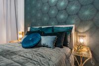 Posteľ alebo postele v izbe v ubytovaní Mennica Residence Chic Apartment
