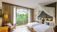 Tejaprana Resort & Spaにあるベッド
