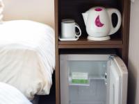 Natural Hot Spring SUPER HOTEL Kumamoto Chamber of Commerceにあるベッド