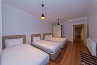 Postel nebo postele na pokoji v ubytování Joy Suites