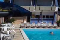 a person in the swimming pool at a resort at Spazio Marine Hotel - Guaratuba in Guaratuba